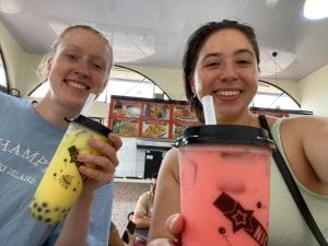 Two young women posing with bubble tea